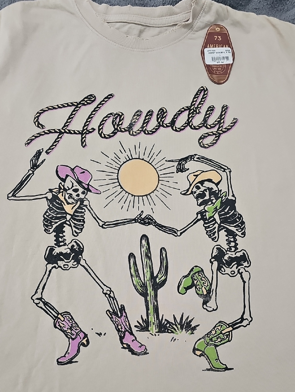 Howdy Skeleton Western Graphic Tee - Beige with Pink & Green Accents